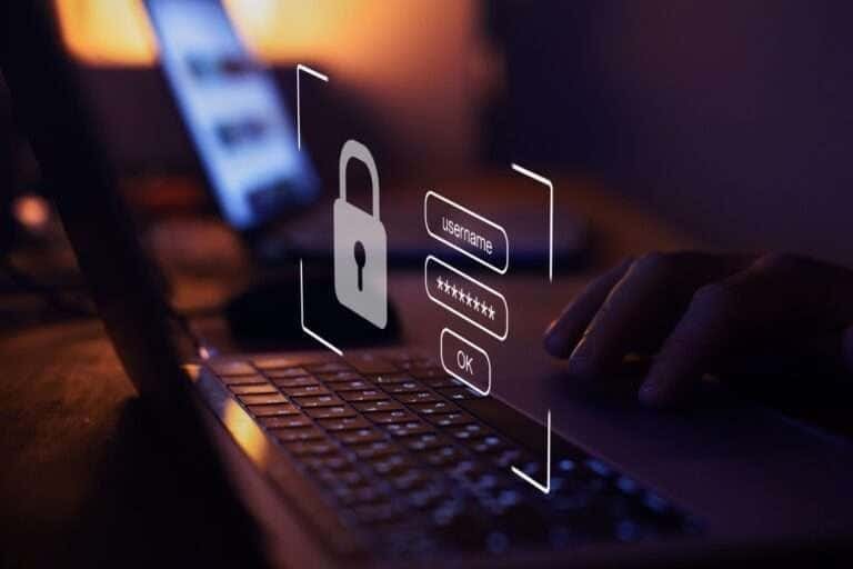 Secure login interface with password and username fields on a laptop.